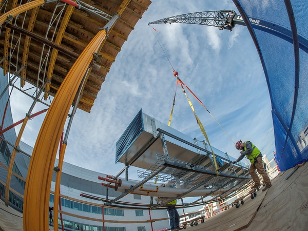 J.F. Ahern: Craning in prefab ductwork.